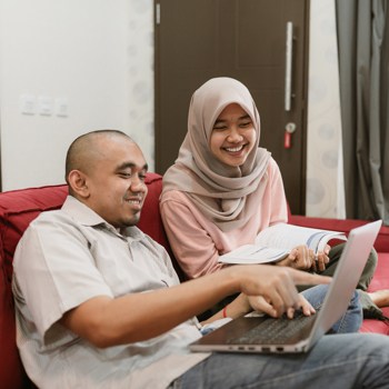 asian young hijab woman studying together with her boy friend